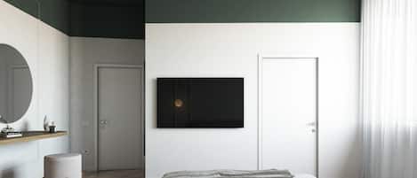 Un dormitorio moderno con cama, televisor montado, espejo y puerta.