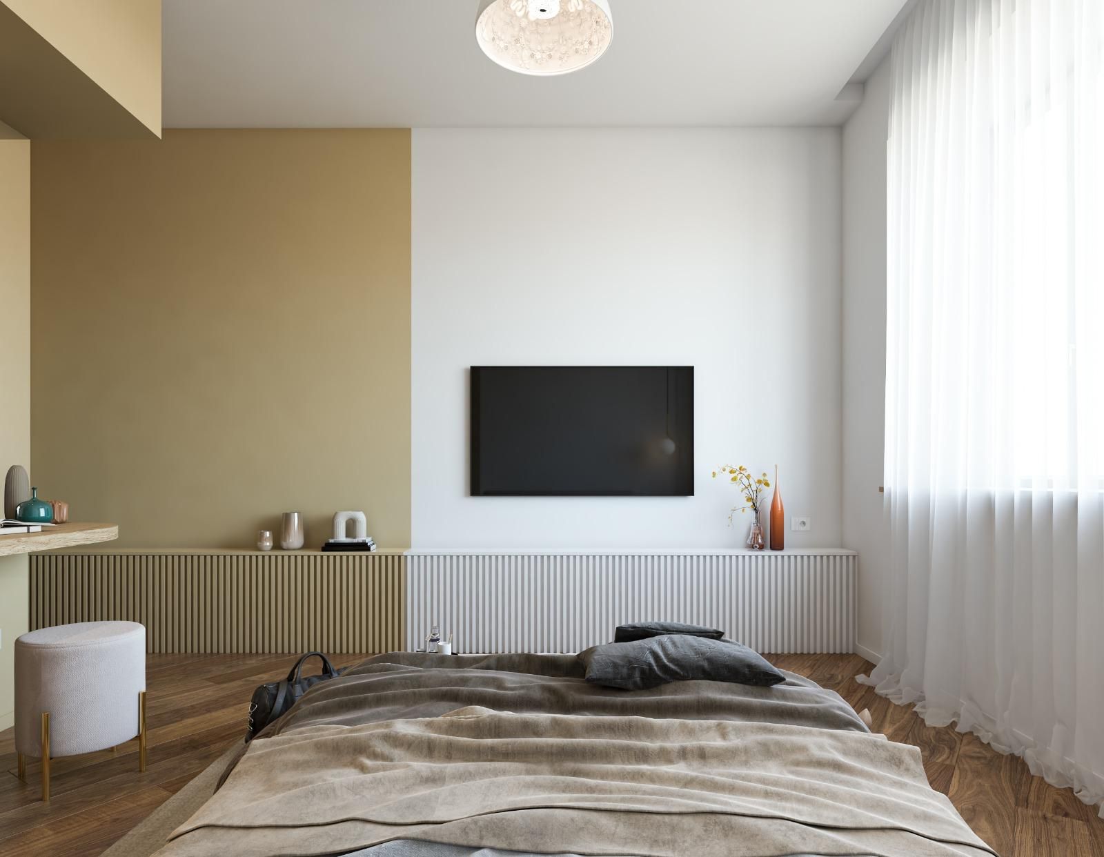 A modern bedroom with a bed, a mounted TV, bedside tables, and a radiator.