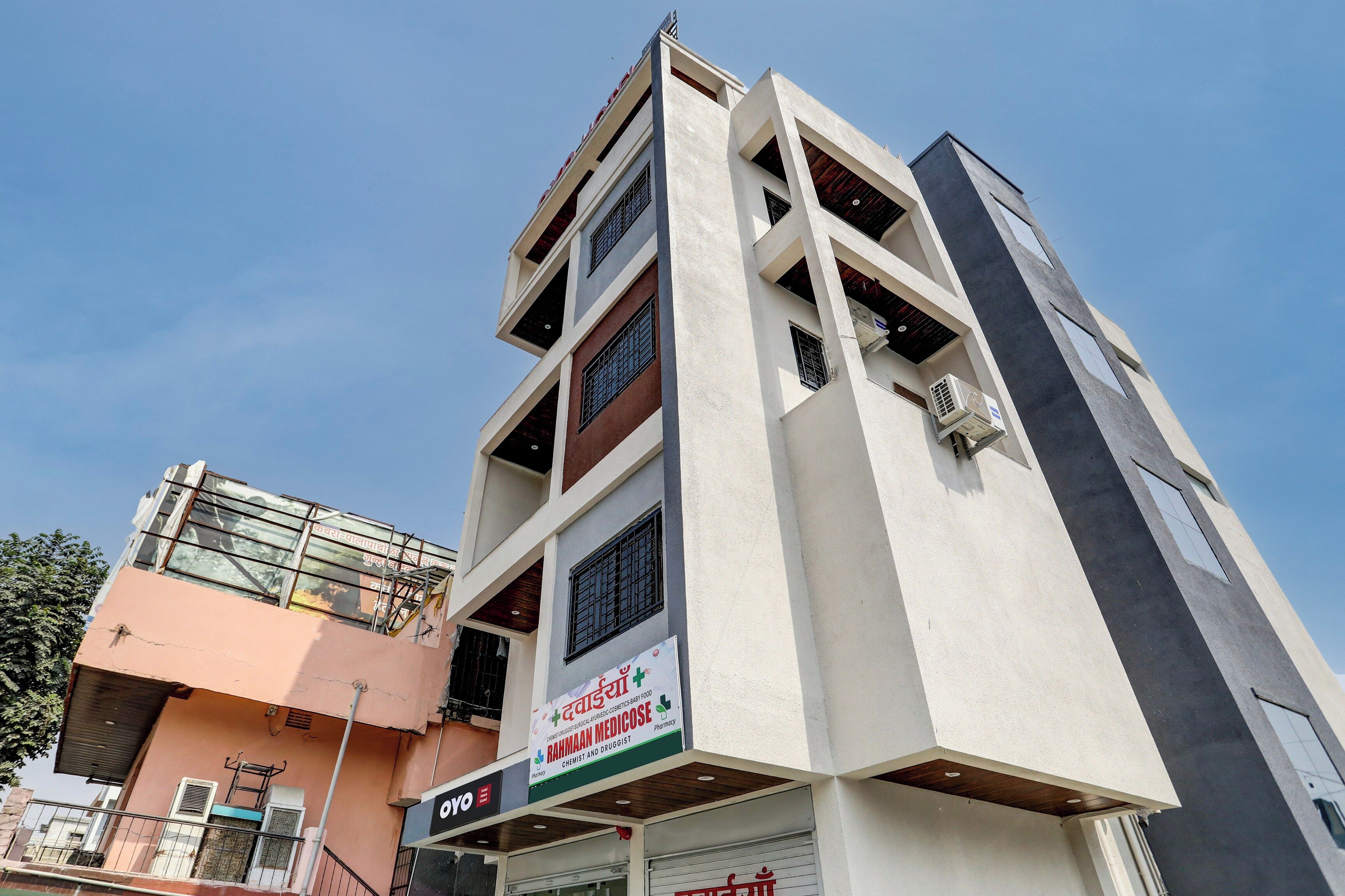 A multi-story building with a pharmacy on the ground floor.