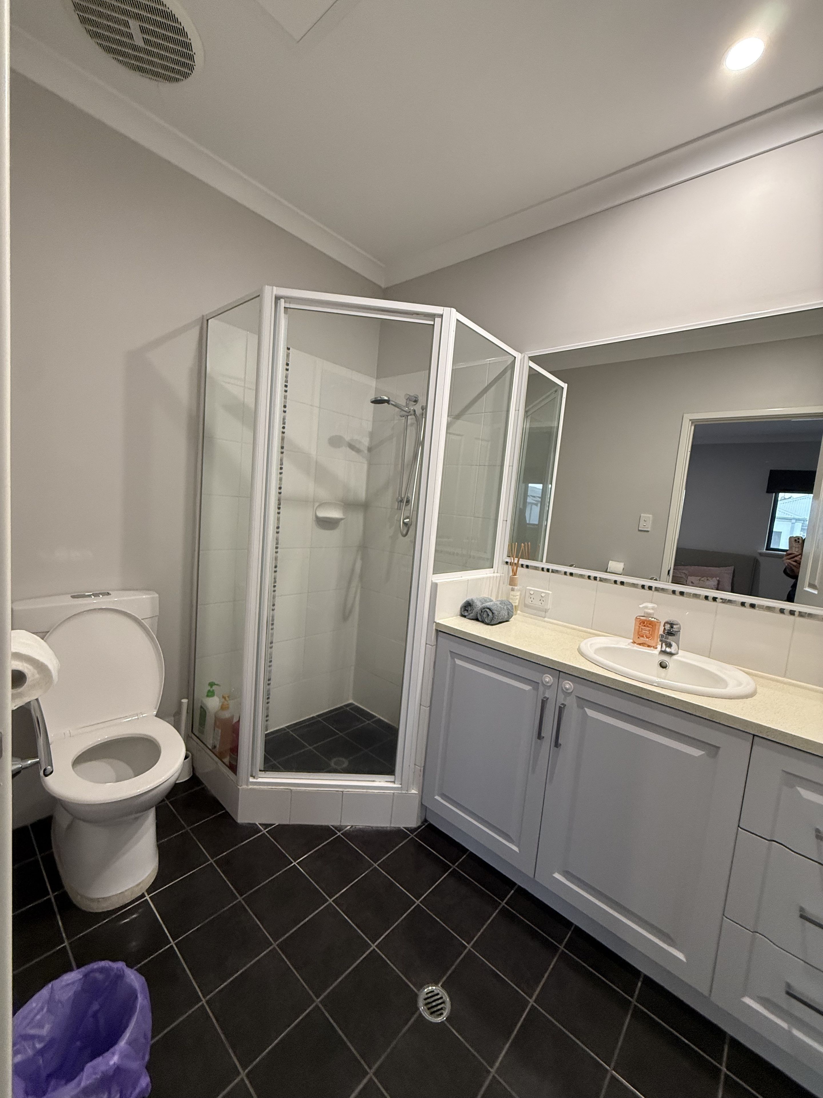 Bright modern bathroom with large walk-in glass shower