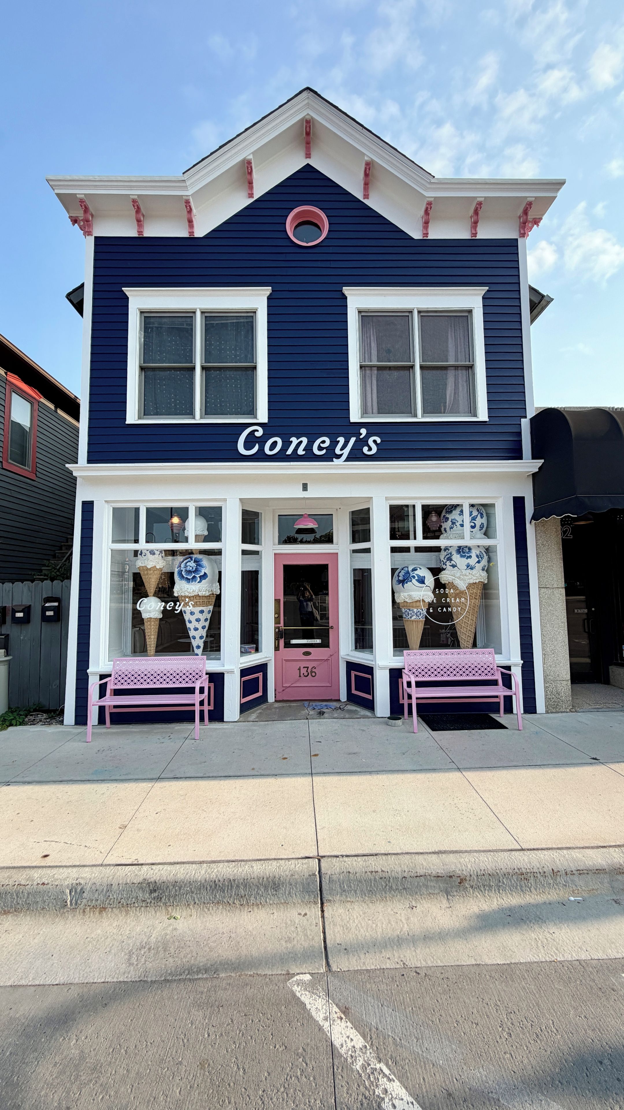 A two-story building with a sign reading 'Coney's' above the entrance.