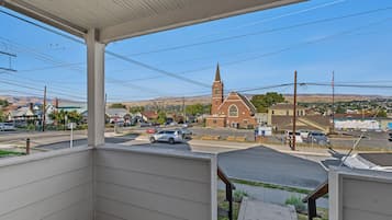 A residential area with a church, a parking lot, and a clear view of the surrounding landscape.