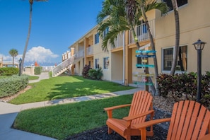 A hotel with a pool, outdoor seating, and a clear view of the ocean. - Gulfstream | Sunrise Beach Days | Pool + Beach (Gulfstream)