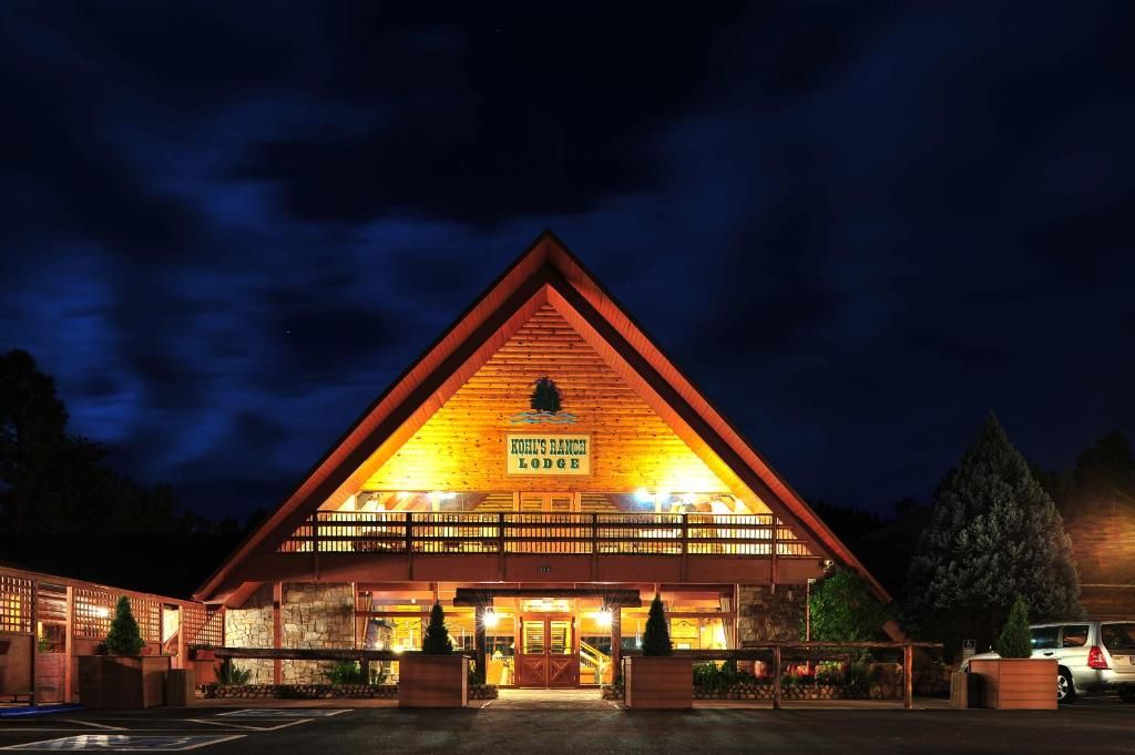 A lodge with a prominent triangular roof and a sign reading 'Kohler's Ranch Lodge.'