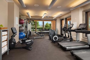 A gym with treadmills, elliptical machines, and free weights. - Palm Springs | Desert Friends Retreat | Pool + Golf | 2BR (Rancho Mirage)