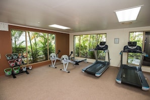 A gym with treadmills, exercise bikes, and kettlebells. - Denarau | Group Island Paradise | Full Kitchen & Balcony | 2BR (Nadi)