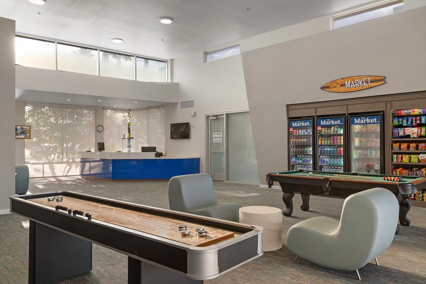 A pool table, billiards, a reception desk, a vending machine, and a pool table.