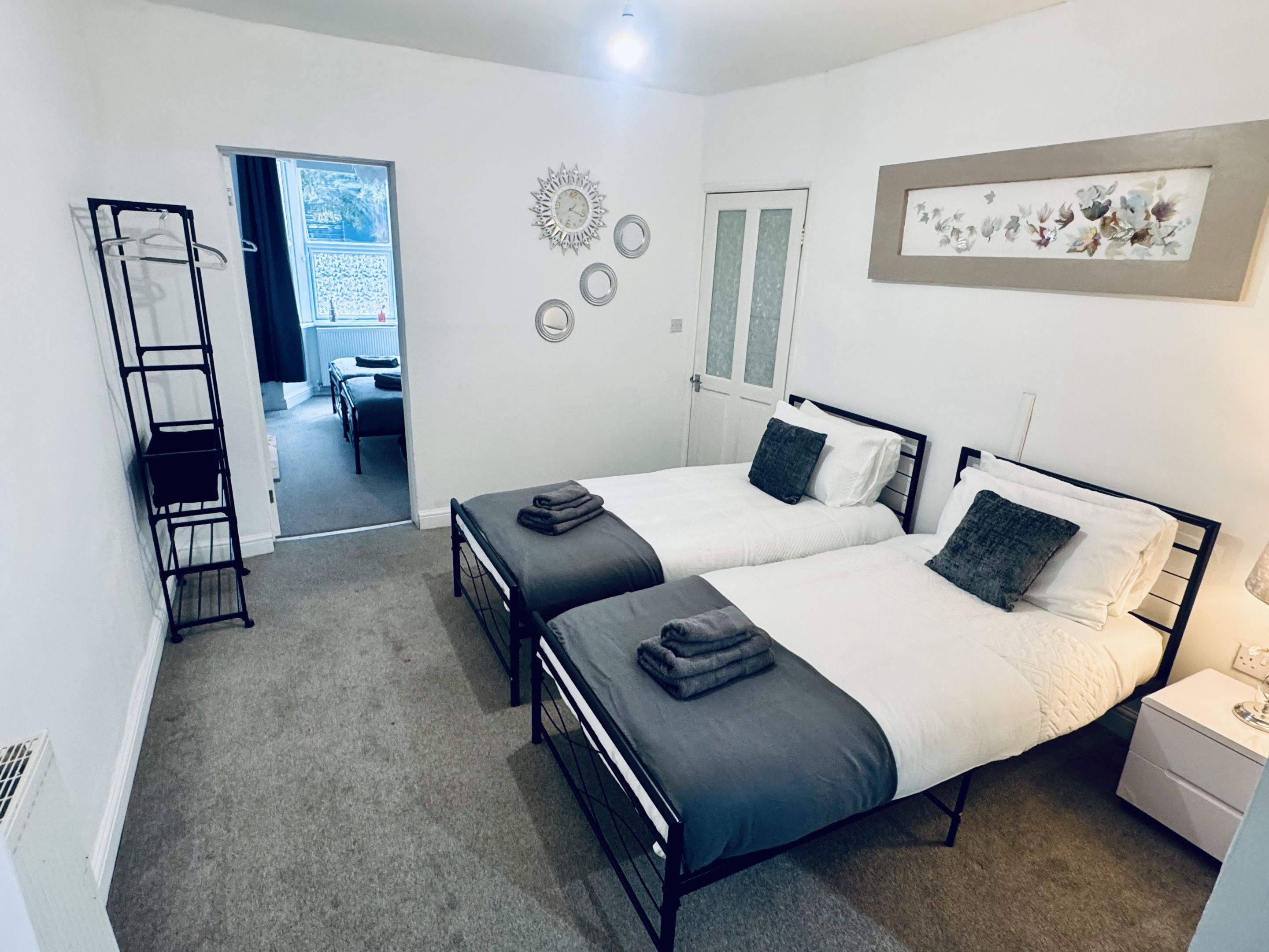 A comfortable bedroom featuring a cosy bed and relaxing atmosphere, perfect for a restful night’s sleep.
