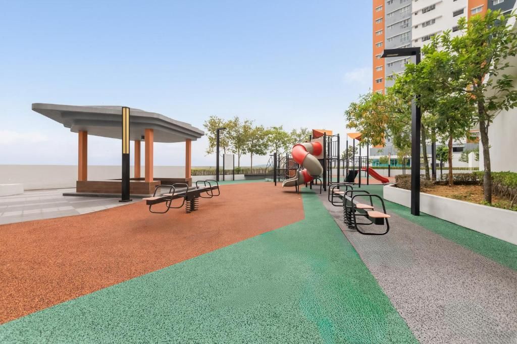 A playground with a slide, swings, and a climbing structure.