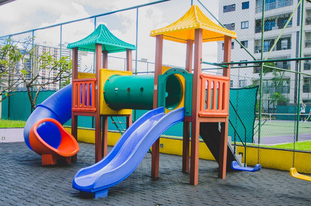 A playground with slides and climbing structures.