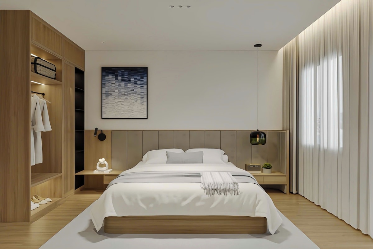 A modern bedroom with a bed, nightstands, a wardrobe, and a painting.