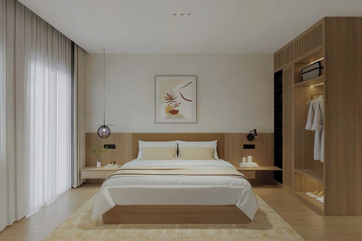 A modern bedroom with a bed, bedside tables, a wardrobe, and a wall-mounted artwork.