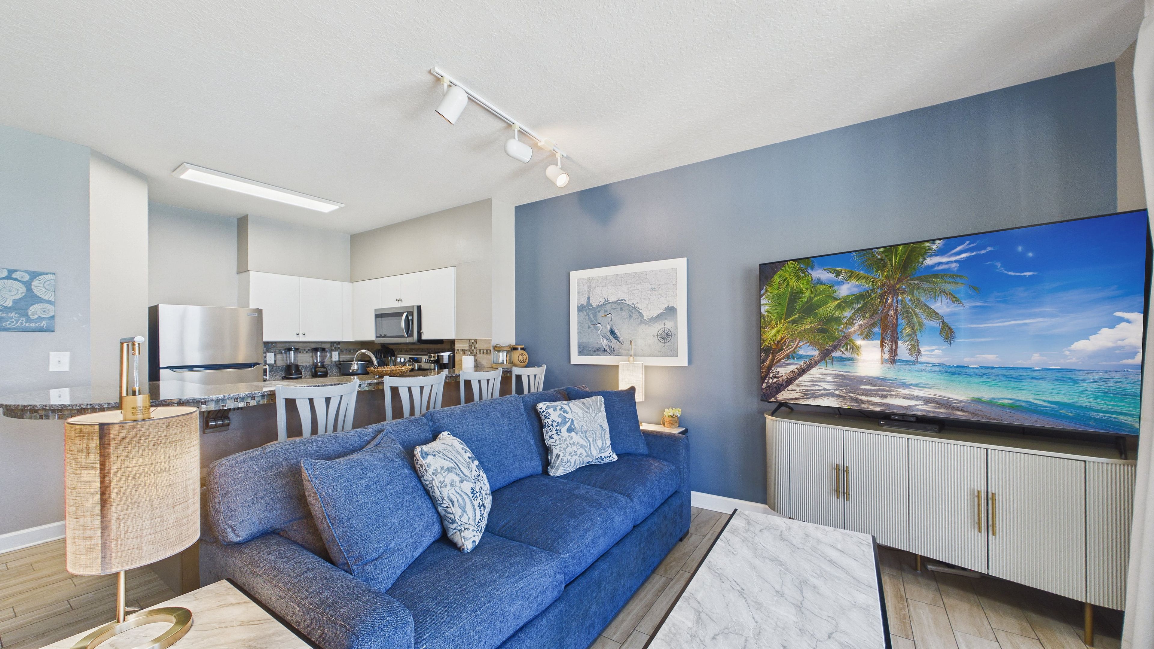 Living area with HUGE TV and comfy furnishings + sleeper sofa (sleeps 2)