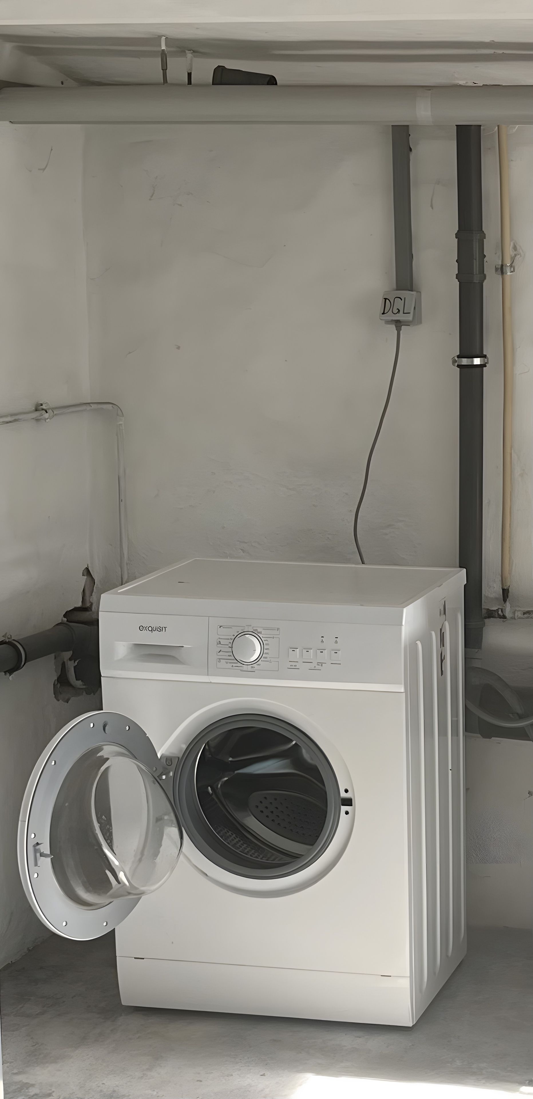 A front-loading washing machine with a control panel, a power outlet, and a water inlet pipe.