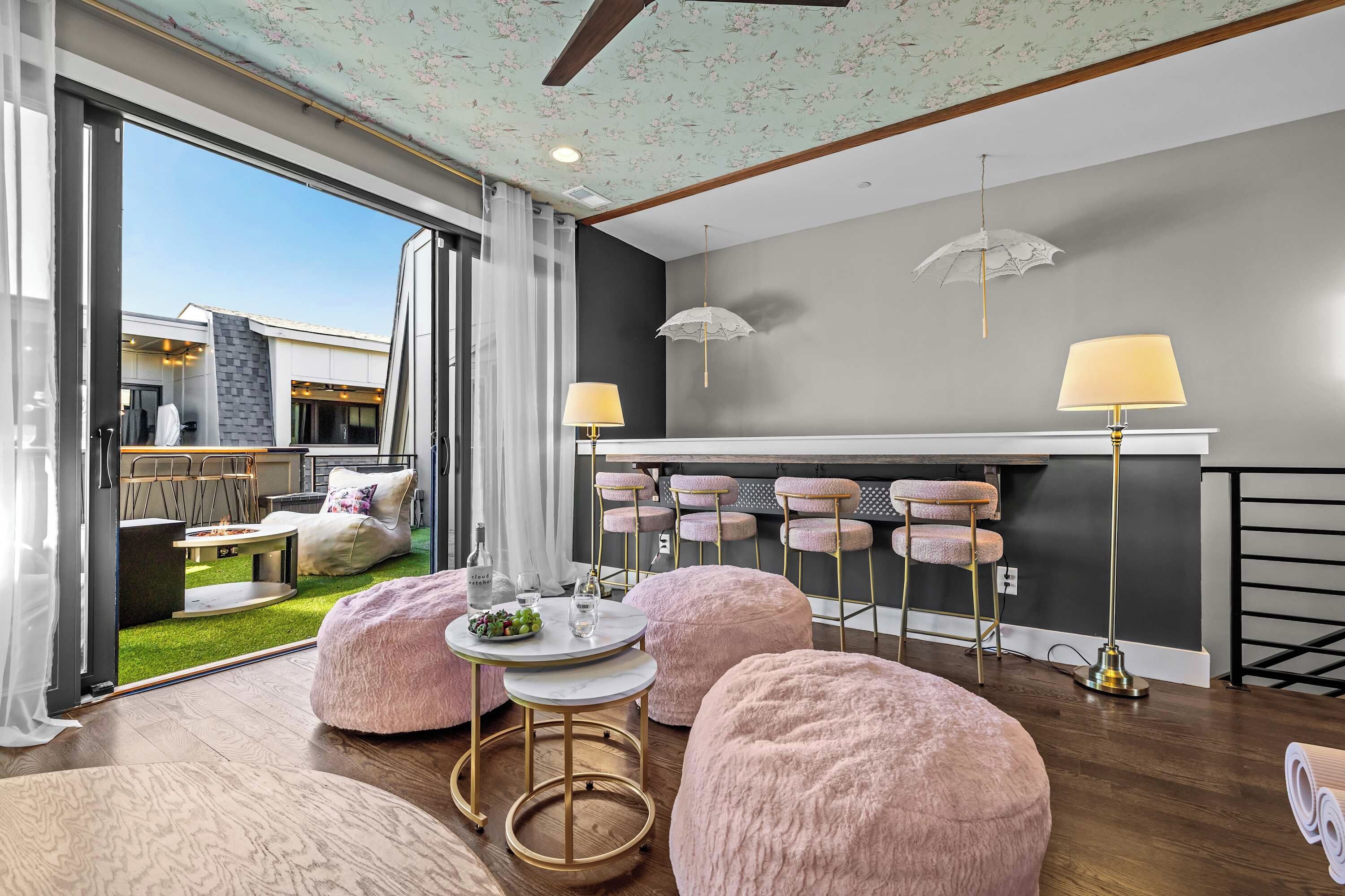 4th Floor Lounge: Bar Seating, Pink Poufs + Rooftop Access