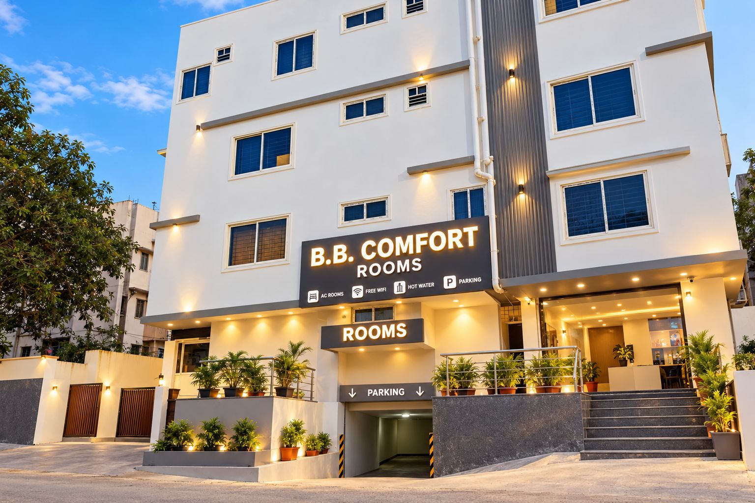 A multi-story hotel named 'B.B. Comfort Rooms' with a sign indicating amenities such as AC, free WiFi, hot water, and parking.