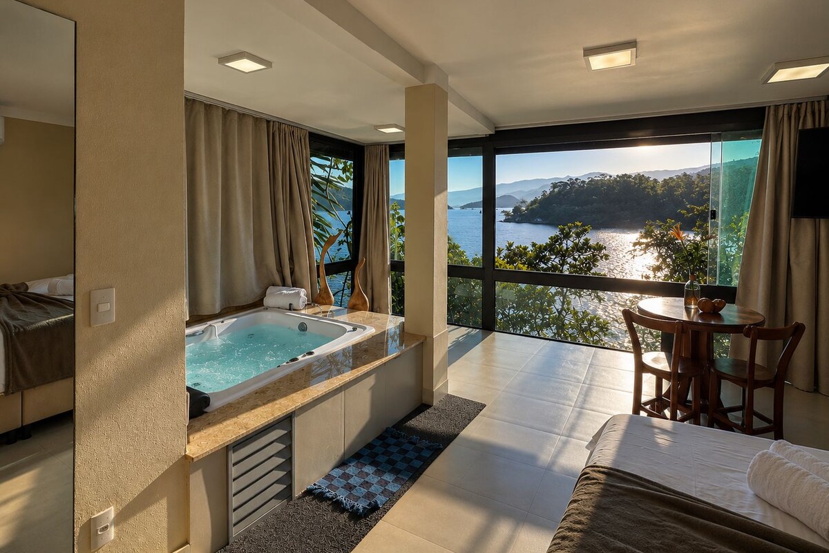 Une chambre moderne dotée d’une grande fenêtre, d’un jacuzzi, d’un coin repas et d’un lit.