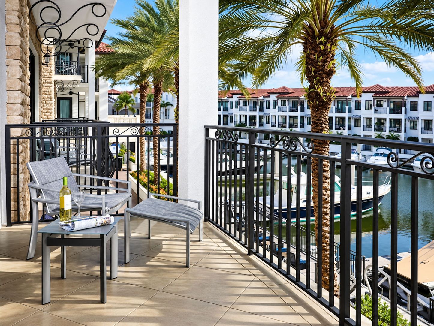 Furnished balcony with seating and marina view