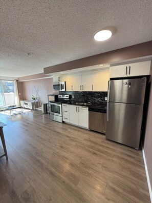 Private kitchen - Furnished Sunalta Condo | Steps to CTrain | Pet-Friendly (Calgary)