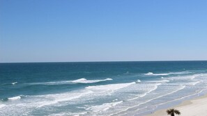 A beach with waves, a clear sky, and a sandy shore. - Beachside Getaway: Studio Starboard Villa at Sea Club IV by Capital Vacations (Daytona Beach Shores)