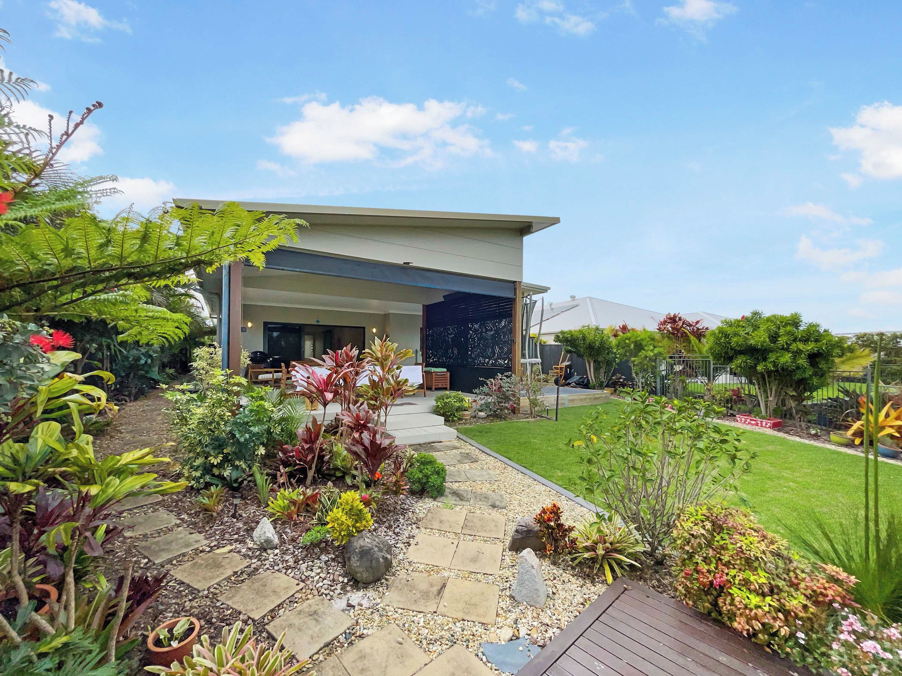 Relaxed outdoor living with a picturesque garden outlook, ideal for making the most of sunny afternoons
