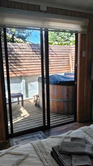 A room with a sliding glass door leading to an outdoor patio area. - New Listing (Valdivia)