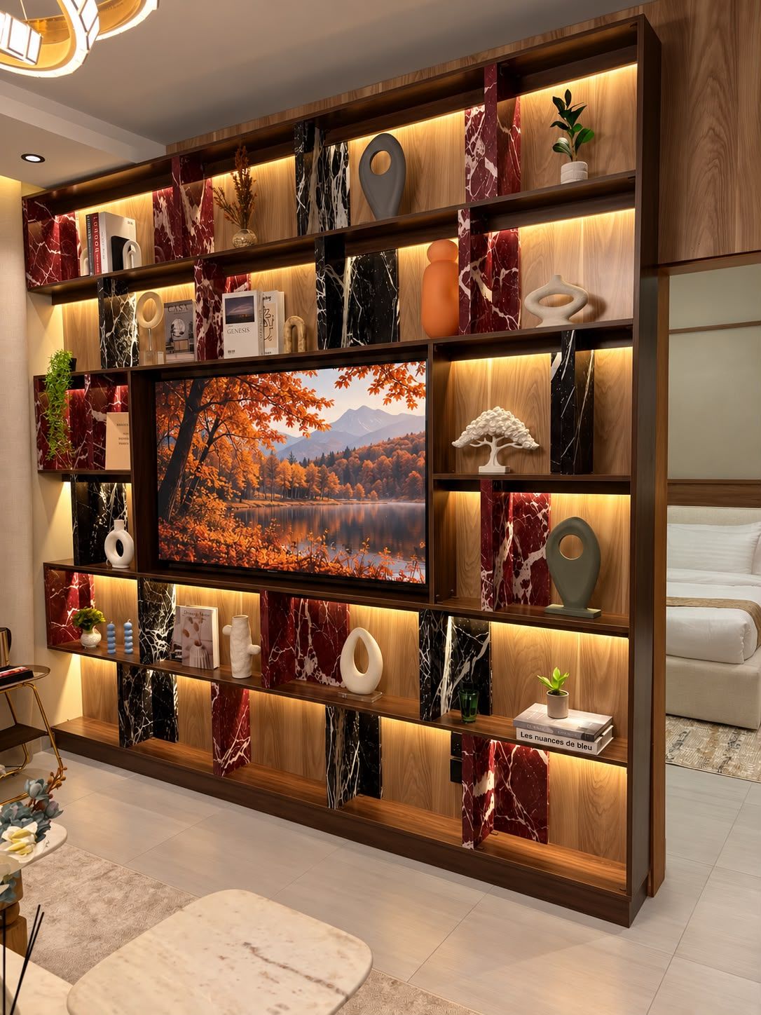 A modern living room with a large flat-screen TV, wooden shelving with decorative items, and a cozy seating area.