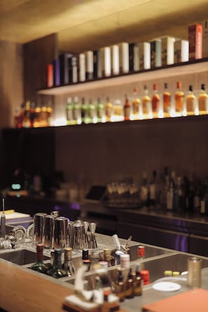 A bar area with various bottles and bar tools. - Hylla Casa (Chongqing)