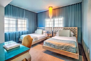 A hotel room with two beds, a desk, and a chair. - Dream South Beach, by Hyatt | Pet-Alloweed | Nikki Beach Miami Beach - 0.9mi (Miami Beach)