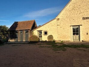 A two-story stone building with a sign reading 'LE RIO'. - New Listing (Farges-Allichamps)