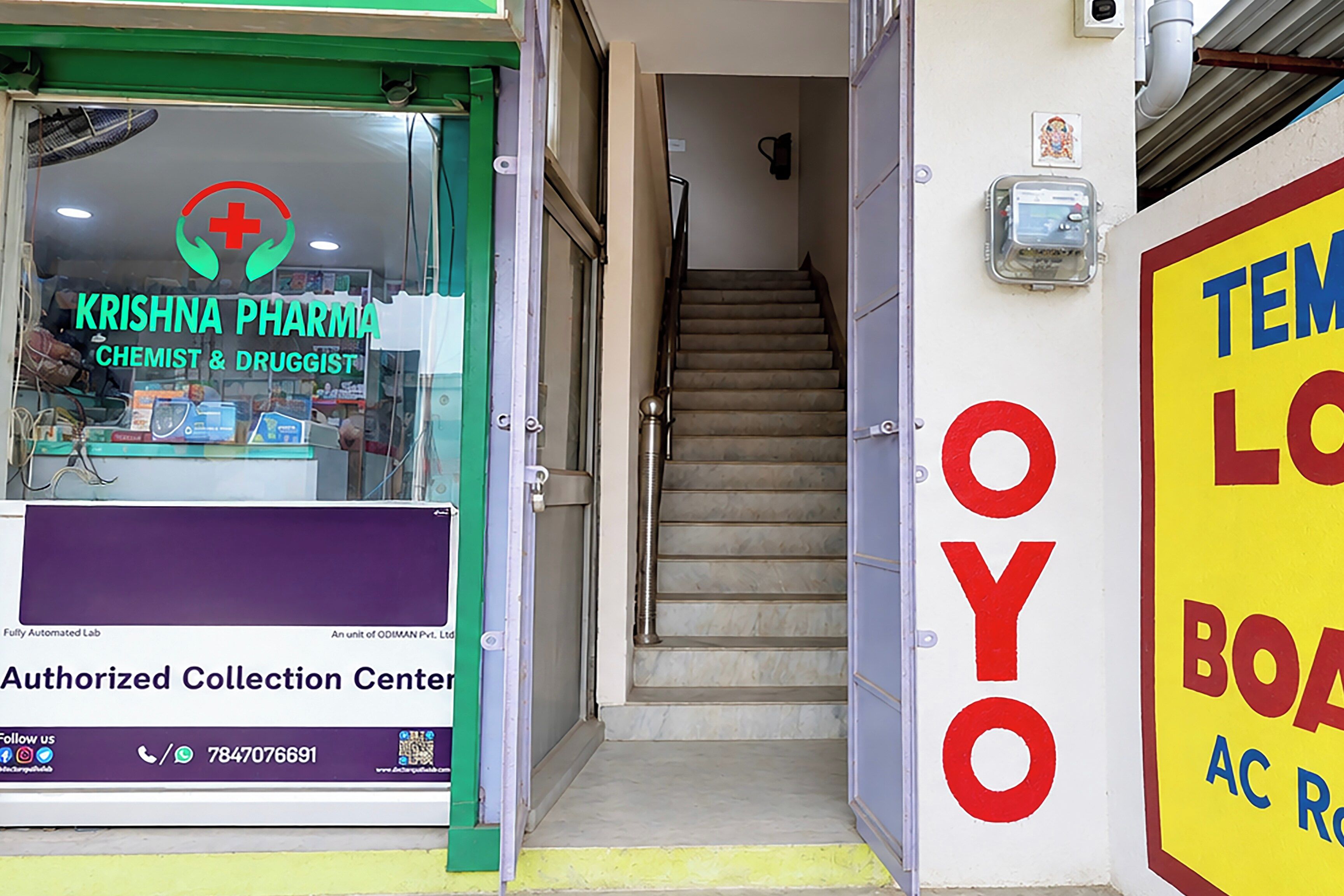 A pharmacy named 'Krishna Pharma' with a sign indicating it is a chemist and druggist.