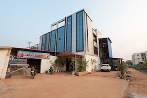 A commercial building with a signboard advertising a business. - Hotel O Ezy Sleep (Bhubaneswar)