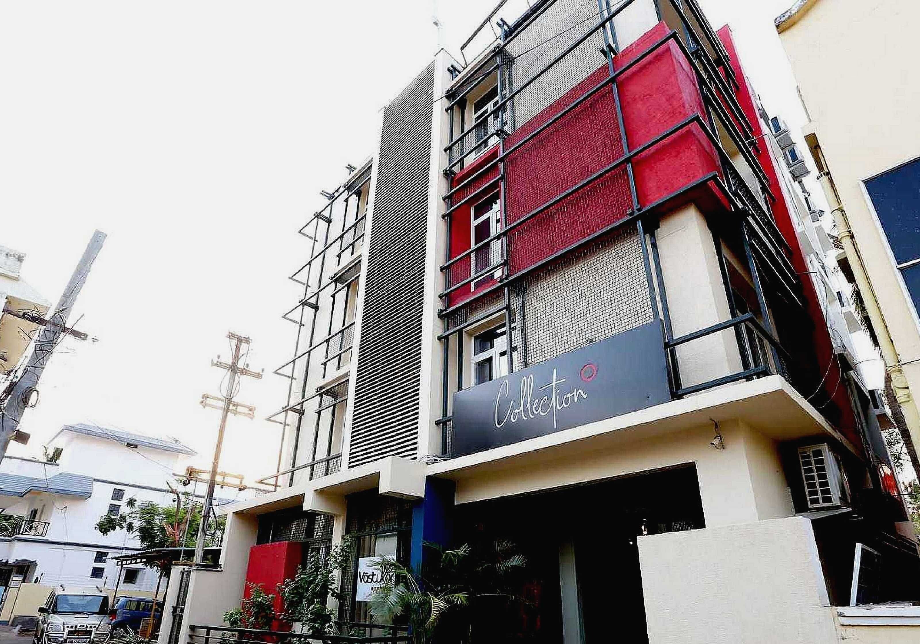 A multi-story building with a modern facade, including a prominent red and black color scheme.
