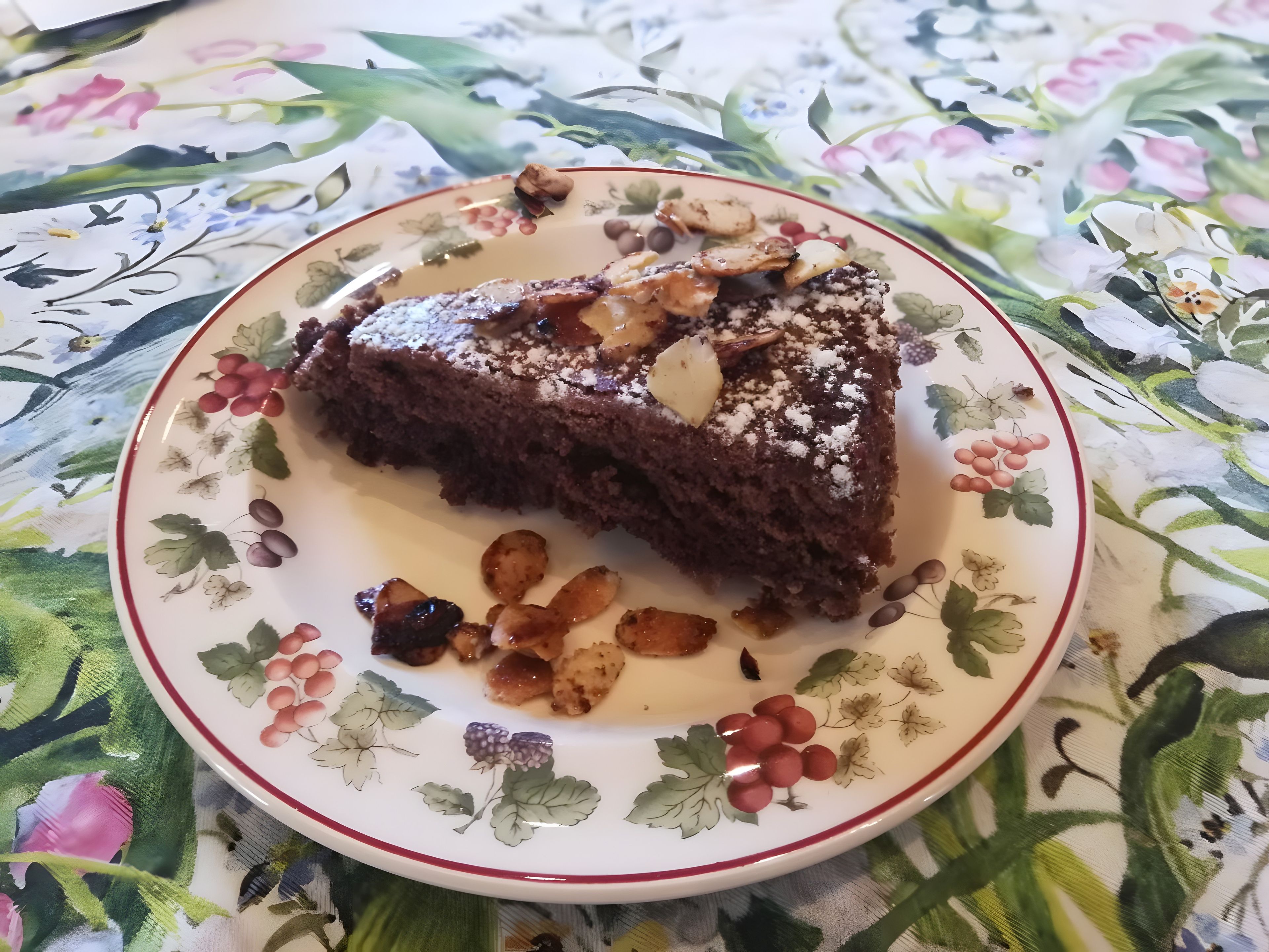A slice of cake on a floral plate.
