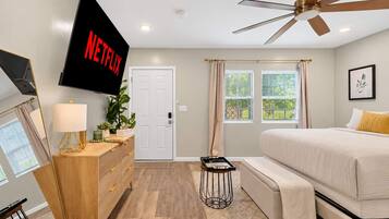 Bedroom 1: Feel right at home in this cozy bedroom with a comfortable bed and TV for entertainment. Enjoy a relaxing atmosphere that's perfect for unwinding and getting a good night's rest.