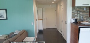 A hallway with a sofa, a refrigerator, and a dishwasher. - River landscape close to the centre, Himos 8km (Jämsä)