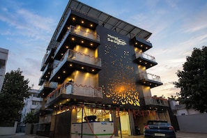 A multi-story hotel with balconies, a prominent logo, and a sign indicating the name 'Hotel Seagull.' - Hotel O Seagull (Port-Blair)