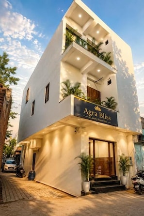 A modern two-story building with a sign reading 'Agra Bliss Luxury Home.' - Agra Bliss A Luxury Homestay (Agra)