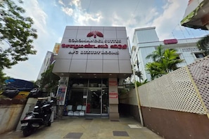 A hotel entrance with a sign for 'Coromandel Suites' and 'A/C Luxury Rooms'. - FabHotel Coromandel Suites (Chennai)