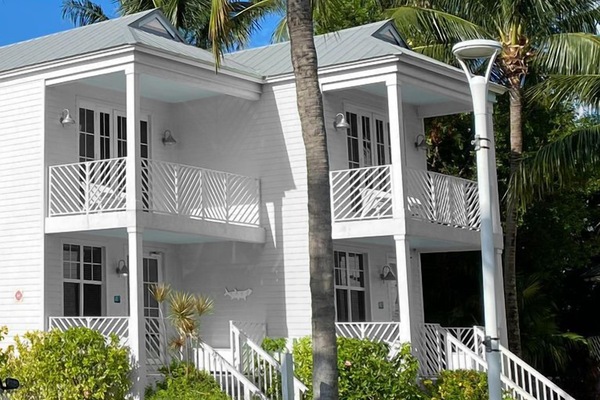Arrive to a bright tropical retreat framed by swaying palms.