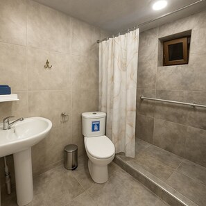 A bathroom with a sink, toilet, shower curtain, and a small window. - Enjoyable 1-bedroom house with AC in charming Armavir (Armavir)