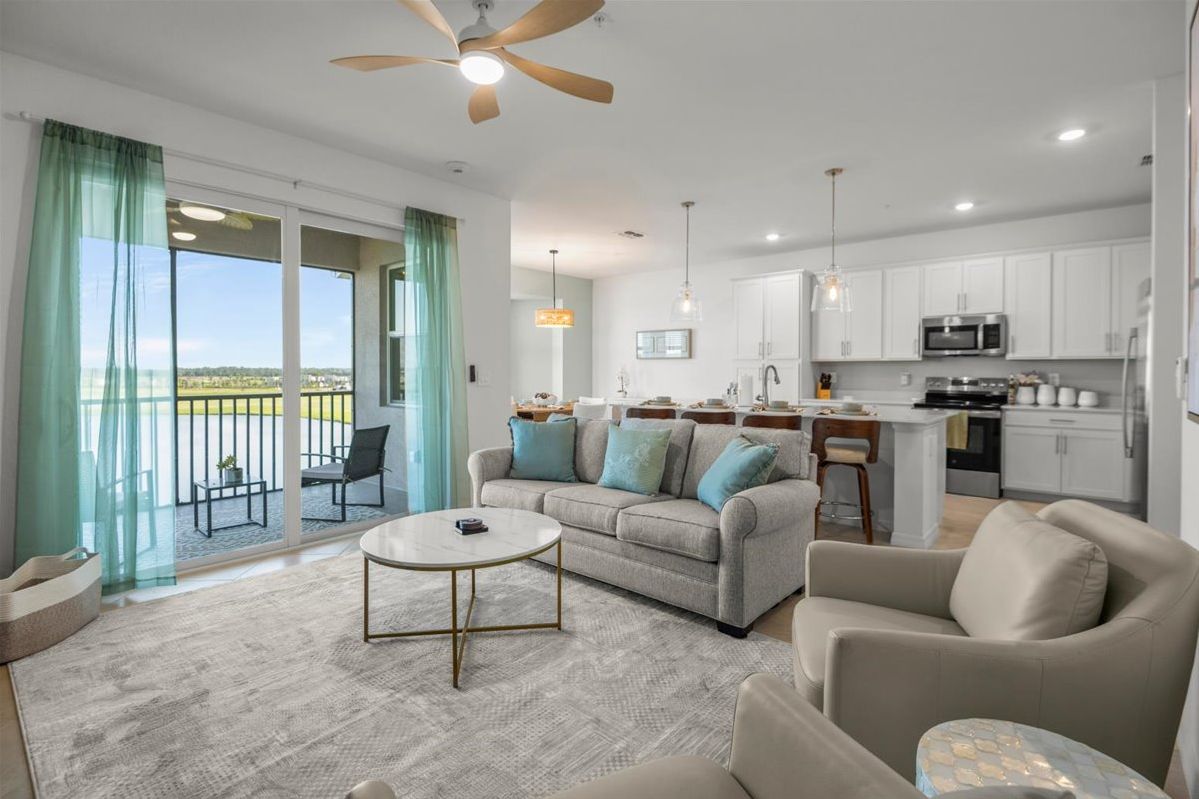 Bright open living area beside the screened balcony