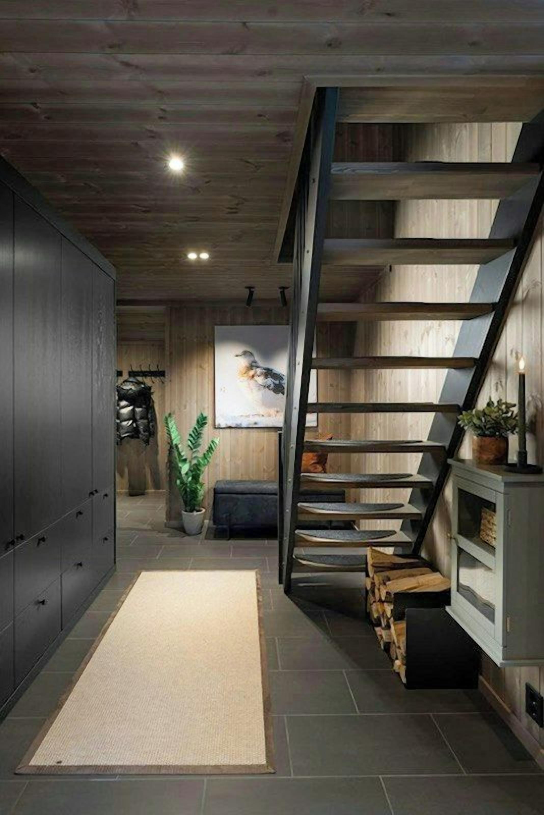 A modern interior with a wooden staircase, a kitchen area, and a living space.