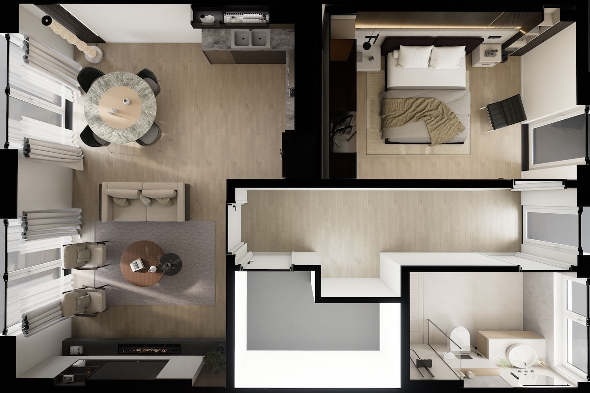 Una habitación de hotel moderna con cama, mesita de noche y baño con ducha e inodoro.