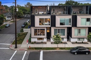 A modern multi-story residential building with large windows and a flat roof. - Twin Terraces-Skyline Views with Two Rooftop Decks (Cleveland)