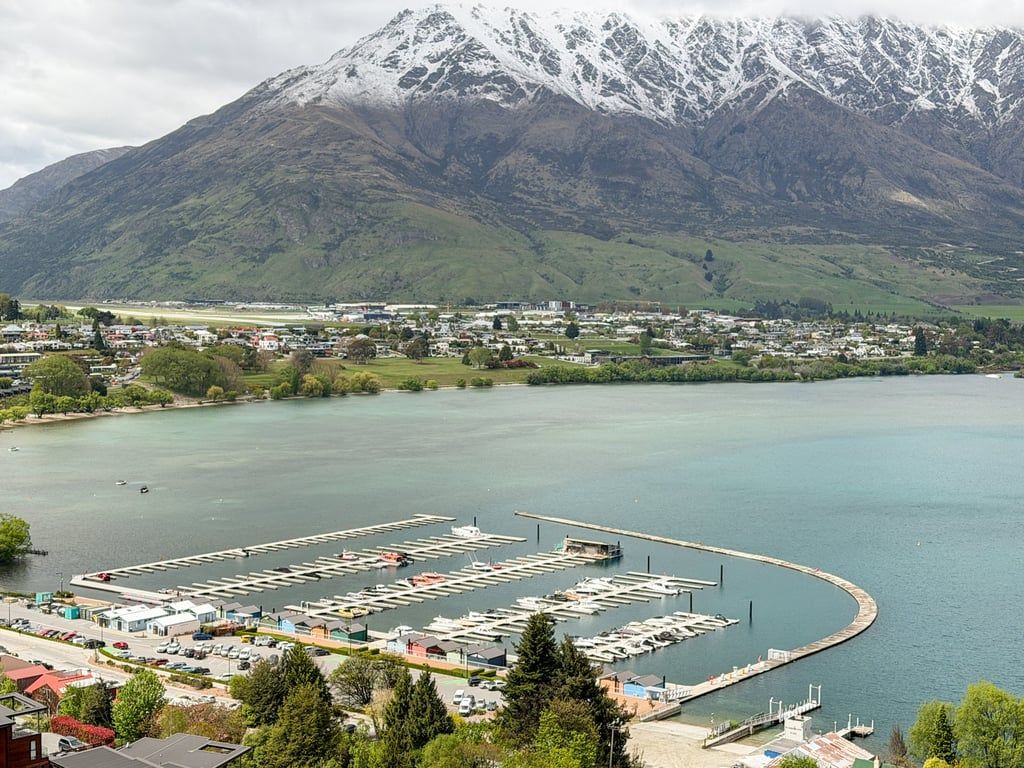 A marina with boats docked, a marina with boats docked, a marina with boats docked, a marina with boats docked, a marina with boats docked.