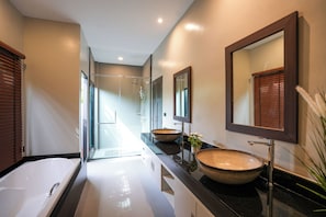 A modern bathroom with a glass-enclosed shower, a large bathtub, and two vessel sinks. - Secluded 3BR Pool Villa near Nai Harn Rawai (Tambon Rawai)