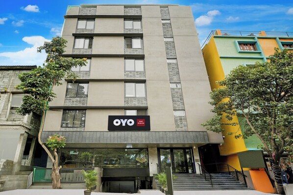 A hotel building with a sign reading 'OYO Hotel Arrow Inn.' - Hotel O by OYO Arrow Inn (Bangalore)