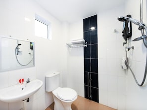 A modern bathroom with a toilet, sink, and shower. - Lawten Hotel By Host Platinum (Melaka)