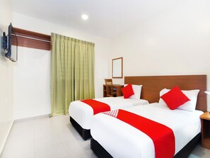 A hotel room with two beds, a wooden headboard, a desk, and a television on the wall. - Lawten Hotel By Host Platinum (Melaka)
